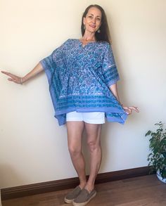 Beautiful, feminine 1/2 length kaftan cotton top.   Perfect to wear over shorts, slim skirt, jeans, or as a swimsuit coverup! Colorful addition to your summer beach wear!  One Size. Ties just under the bust.  Choose from Green & Yellow or Dark & Light Blue floral Length = 29.5 inches from shoulder Kaftan Top, Short Kaftan, Skirt Jeans, Slim Skirt, Boho Blouse, Dark Light, Summer Beach Wear, Cotton Blouse, Fabric Pattern