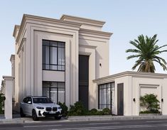 a white car parked in front of a two story house with palm trees on both sides