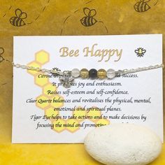 "(Gift wrap available at check out) If you need more than 1 gift wrap, please buy them separetly in my shop. You'll find the option under the section \"Gift Wrap\") 🐝 Bee Happy bracelet, perfect for yourself  or as gift!! 🐝 Ideal for any occasions!! 🐝 All my crystals are natural in order to preserve all their qualities. These crystals have been chosen and put together based on their qualities to promote calm and relax. About the Gemstones: Citrine Tiger Eye Clear Quartz  Citrine: attracts wea Handmade Inspirational Beaded Bracelets As Gift, Inspirational Handmade Beaded Bracelets As Gift, Inspirational Silver Beaded Bracelets As Gift, Silver Hand Wrapped Crystal Bracelet Gift, Spiritual Beaded Bracelets For Mother's Day Gift, Gemstone Charm Bracelet Gift, Spiritual Crystal Bracelet With Gemstones As Gift, Spiritual Charm Bracelet With Natural Stones For Gift, Spiritual Charm Bracelet Gift