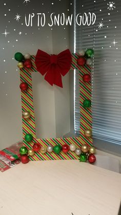 an up to snow good photo frame made out of candy canes and christmas decorations