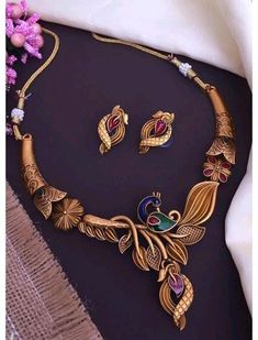 Material:- Brass, Gold Platted Pack- Necklace Set With Earrings These Beautiful Gold Platted Necklace Best for gifting and personal use, You can gift your Girlfriend, Mother, Sister , Relatives , Neighbours etc. Combine it with Matching Dress and be the Limelight of every Occasion ( Diwali, Birthday, Anniversary, Christmas, Any Ritual Festival). Suitable for all Occasions. a)These are very skin Friendly. b)The plating is Non- Allergic and safe for all Environment. Gift for Her, Best Friend Gift, Multicolor Peacock Design Jewelry Sets For Diwali, Gold Jewelry Sets With Peacock Design For Festivals, Gold Sets With Peacock Design For Festive Season, Elegant Gold Set With Peacock Design, Elegant Gold Sets With Peacock Design, Festive Gold Sets With Peacock Design, Festive Multicolor Peacock Jewelry Sets, Festive Multicolor Peacock Design Jewelry Sets, Traditional Gold Sets With Peacock Design