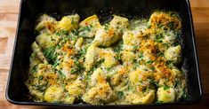 a casserole dish with broccoli and cheese