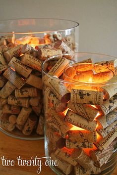 two glass bowls filled with wine corks next to each other