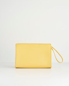 Like a little ray of sunshine, shining on your outfit, this wristlet pouch from our Meadow Creatures collection with its expertly crafted design comes in vibrant Sundress Yellow. Adding an instant pop of colour to any summer outfit, it’s a perfectly practical sized bag for all your everyday essentials. The chic, wrist handle allows hands free freedom, whilst Fable’s signature bee in gold-tone hardware adds a contemporary luxe finish.
  Key features:
  Approx. 19 (L) x 13 (H) x 6 (D) cm
 Outer: 1 Summer Travel Pouch With Removable Pouch, Summer Handheld Pouch For Daily Use, Summer Travel Pouch With Removable Section, Casual Summer Clutch With Removable Pouch, Chic Summer Travel Pouch, Chic Rectangular Summer Pouch, Trendy Summer Travel Pouch, Summer Travel Pouch Clutch, Summer Travel Clutch Pouch