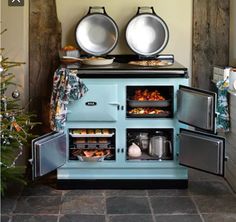 an old fashioned stove with pots and pans on top