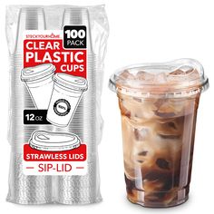 a plastic cup filled with iced coffee next to a bag of sip lid