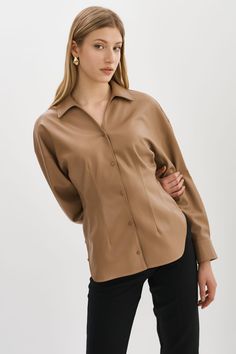 Indulge your fashion sensibilities with the irresistible allure of the Skylar Faux Leather Shirt. Designed to captivate, this statement piece boasts an hourglass silhouette & tapered waist. Hourglass Silhouette, Leather Shirt, Shirt Collar, Mocha, Statement Pieces, Faux Leather, Collar, Leather