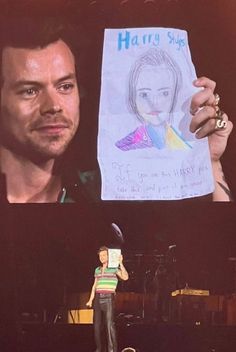 a man holding up a paper with a drawing of a woman on it in front of him