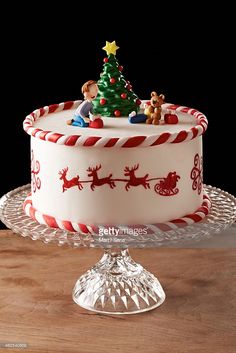 a decorated christmas cake on a glass platter stock photo getty images black bedroom furniture sets home design ideas