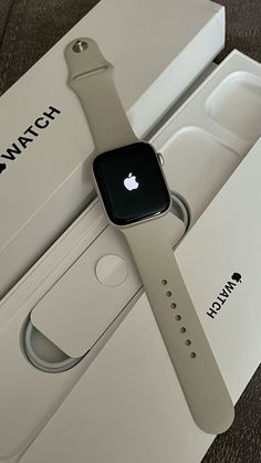 an apple watch sitting in its box on the floor