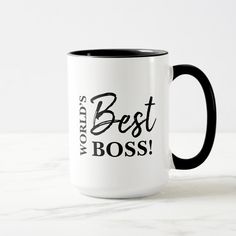 a black and white coffee mug with the words world's best boss on it