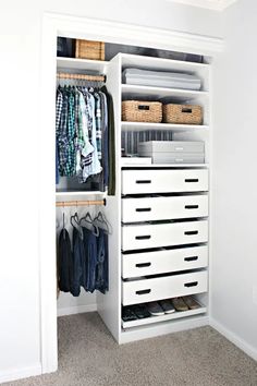 an organized closet with drawers and clothes