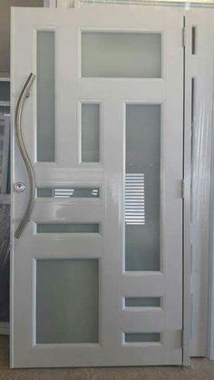 a white door with glass inserts on the front and side panels that are open