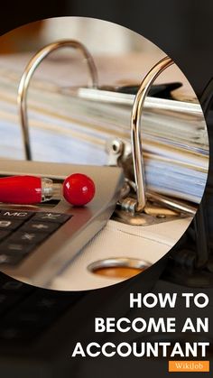 a close up of a computer keyboard near a stack of papers and a red pen