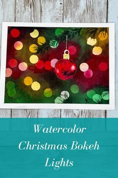 watercolor christmas bokeh lights with text overlay that reads watercolor christmas bokeh lights