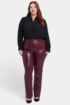 Our most popular silhouette, now in super-sculpting compression faux leather. NYDJ's Faux Leather Marilyn Straight Pants in Plus Size have a flattering and versatile straight-leg fit that elongates the figure, while their texture adds a bold edge to outfits. Lift Tuck® Technology uses a proprietary slimming panel with a patented criss-cross design to shape and support your curves for even more sleekness. The styling of this pair is finished with five pockets and a zip fly with button closure. These pants are part of Sculpt-Her™, NYDJ's most novel collection of compression-contouring silhouettes with an unparalleled, cutting-edge fit. | NYDJ Women's Faux Marilyn Straight Pants In Plus Size in Tavern, Size: 18W | Leather Plus Size Leather Pants, Mid Size Fashion, Cross Design, Mid Size, Petite Outfits, Artificial Leather, Pants Straight, Straight Pants, Jeans For Sale