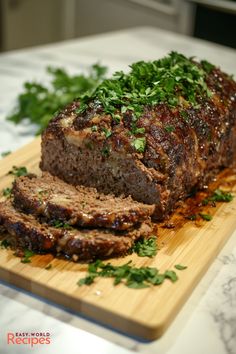 meatloaf with herbs on a cutting board