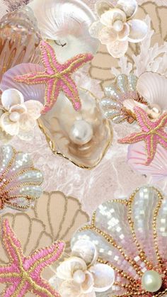 seashells, pearls and starfish are arranged on a tablecloth with gold sequins