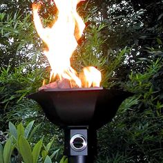 a fire pit with flames coming out of it