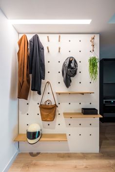 there is a coat rack on the wall