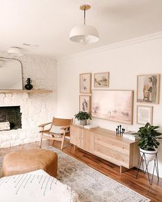 a living room filled with furniture and a fire place