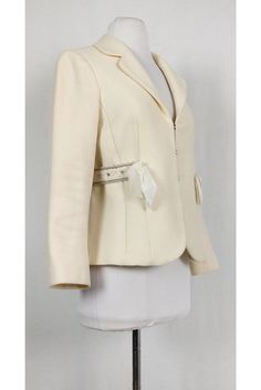 This wool blend blazer is made in a rich cream hue. Beaded & ribbon detail at the waist adds a sweet touch. You will love how versatile this blazer is. Size 6 80% wool, 20% polyamide Collar Hook & eye front closure Long sleeve Lined Beaded detail at waist Bow detail at waist Bust 34" Waist 32" Shoulder to hem 22.25" Elegant Cream Wool Blazer, Tailored Cream Blazer For Party, Beaded Ribbon, Rebecca Taylor, Hook Eye, Bow Detail, Women's Blazer, Wool Blend, Cool Designs