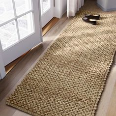 a rug on the floor in front of a door