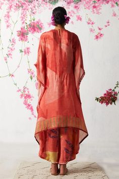 Peach asymmetric hem tunic with all over abstract prints and embellished placket. Paired with coordinating cowl pant. - Aza Fashions Summer Designer Pant Set With Dupatta, Summer Traditional Drape Georgette Salwar Kameez, Summer Sets With Sheer Dupatta And Traditional Drape, Summer Festive Pant Set With Traditional Drape, Summer Sets With Traditional Drape And Dupatta, Traditional Drape Sets With Dupatta For Summer, Summer Georgette Palazzo Set With Traditional Drape, Summer Traditional Drape Palazzo Set In Georgette, Summer Traditional Drape Georgette Palazzo Set