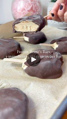 chocolate covered ice cream bars on a table