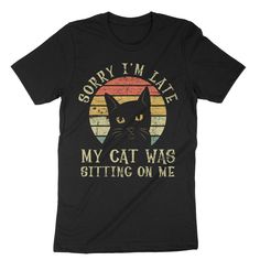 a black t - shirt that says sorry i'm late my cat was sitting on me