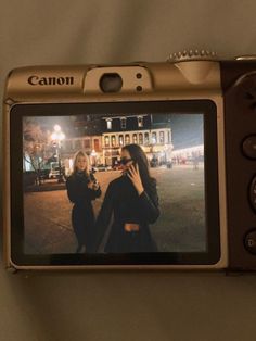 a camera with two women on the screen