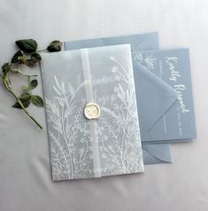 three wedding cards with wax stamp on them