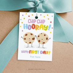 a gift tag that says chip chip hooray happy first day with two cookies on it