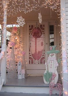 christmas lights decorate the front porch of a house