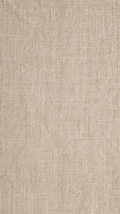 a close up view of a beige fabric texture