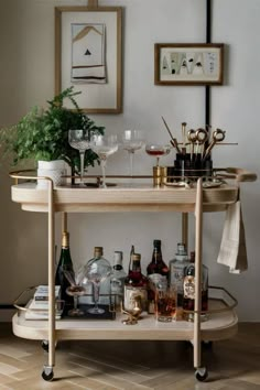 a bar cart filled with bottles and glasses