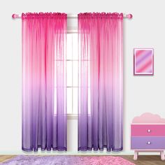 a bedroom with pink and purple curtains on the window sill, bedding and dresser