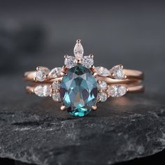 an engagement ring with a blue diamond surrounded by white diamonds