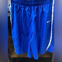 Nwt Women’s Royal Blue Nike Athletic Basketball Shorts Women’s - Large The Shorts Have Never Been Worn In Pristine Condition Blue Short Leg Pants With Pockets, Blue Pants With Pockets And Short Legs, Blue Elastic Waistband Shorts, Nike Blue Athletic Shorts For Spring, Blue Nike Cotton Bottoms, Nike Blue Athletic Shorts, Nike Blue Bottoms With Elastic Waistband, Sporty Blue Short Pants, Blue Nike Athletic Shorts With Elastic Waistband