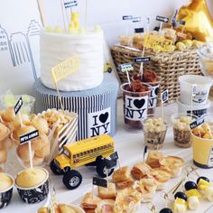 a table topped with lots of food and desserts