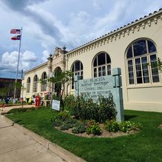 a sign in front of a building that says the american heritage museum and historical library