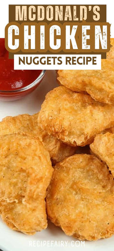 fried chicken nuggets on a white plate with ketchup and sauce in the background