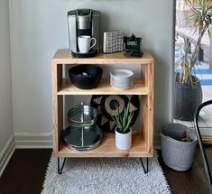 a wooden shelf with plates and cups on it