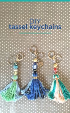 three tasseled key chains are sitting on a polka dot background with the words diy tassel keyschains