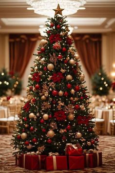 a christmas tree with presents under it in a room decorated for the holidays and new year