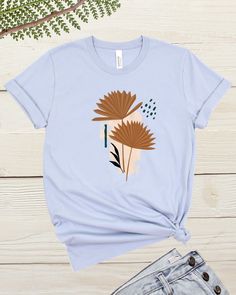 Boho Womens Graphic tshirt is a simple yet trendy design made to make a statement.  This unique and simple peace of art on a tee is perfect for  everyday wear and adds a classic touch to casual dress.  This classic unisex jersey short sleeve tee fits like a well-loved favorite. Soft cotton and quality print make users fall in love with it over and over again. These t-shirts have-ribbed knit collars to bolster shaping. The shoulders have taping for better fit over time. Dual side seams hold the g Cotton Graphic Tee With Abstract Print, Artistic Cotton T-shirt With Abstract Print, Spring Crew Neck T-shirt With Abstract Print, Modern Graphic Print T-shirt For Spring, Artsy Short Sleeve T-shirt For Spring, Artsy Screen Print T-shirt For Spring, Spring Artsy Short Sleeve T-shirt, Artsy Crew Neck Summer Shirt, Spring Artsy Crew Neck T-shirt