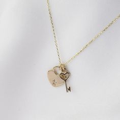 "14K Solid Gold Heart Key Charm and Heart Lock Necklace  The heart key charm is about 13mm x 5mm. It is tiny. The heart lock is flat and it is about 12mm x 10mm. ♡ 14K gold necklace is 0.9mm cable chain It is adjustable to 16\", 17\" or 18\" lengths ♡ 14K gold components" Gold Heart Necklace With Two Keys, Heart Shaped Two Keys Necklace For Anniversary, Elegant Heart-shaped Necklace With Two Keys, Valentine's Day Heart Pendant Jewelry With Two Keys, Key Necklace Aesthetic, Heart Lock Necklace, Deodorant Recipes, Jewelry Traditional, Jewelry Aesthetic