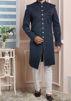 Ready-Made Sherwani With Trouser. Jacquard Brocade Fabric Top. Art Dupion Aligarhi Ready Made Trouser. Crafted in Chinese Collar Neck, and Full Sleeve. Satin Lining with Plain Work. High-Quality Matching Buttons. Please Note: The footwear shown in the picture is for presentation and photography purpose only. Color: There might be slight color variation due to lightings and flashes while photo shooting. The color may also vary because of different screen resolutions. Wash Care: Dry Clean Only. Designer Fitted Traditional Wear For Festivals, Semi-stitched Ceremonial Kurta With Cutdana, Designer Fitted Nehru Jacket With Cutdana, Ceremonial Semi-stitched Cutdana Kurta, Designer Straight Kurta Sets For Wedding, Ceremonial Jamawar Kurta With Cutdana Details, Ceremonial Jamawar Kurta With Cutdana, Designer Fitted Ceremonial Traditional Wear, Formal Embroidered Fitted Kurta