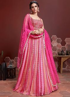 Elevate your style with our exclusive pink sequins and embroidered lehenga choli for women! Made with luxurious chinon silk, this readymade outfit is perfect for any Indian party or wedding. Be the center of attention with our stunning bridesmaids lehenga, designed to make you look and feel your best! The unstitched blouse can be customized upto 46 inches. Do Note: All the accessories shown are for styling purpose only. Slight color variation may occur due to photographic reasons. Occasion : Wed Bridesmaids Lehenga, Lehenga Pink, Lehenga Indian, Lehenga Choli Designs, Ghaghra Choli, Bridesmaid Lehenga, Lehenga Choli For Women, Silk Lehenga Choli, Choli For Women