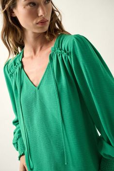 Grateful Spirit Solid Tie-Neck Peasant Top - ShopPromesa Peasant Style V-neck Blouse For Brunch, Green V-neck Peasant Top For Fall, Fall Green V-neck Peasant Top, Green V-neck Blouse With Blouson Sleeves, Spring Peasant Top With Smocked Cuffs And V-neck, Spring V-neck Peasant Top With Smocked Cuffs, Green Blouse With Smocked Bodice For Fall, Fall V-neck Smocked Top With Blouson Sleeves, Spring V-neck Peasant Top With Gathered Sleeves